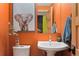 Brightly painted bathroom with modern fixtures, vessel sink, and stylish decor at 3313 Curtis St, Denver, CO 80205