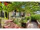 Inviting front porch with seating and vibrant greenery, showcasing the home's curb appeal at 3313 Curtis St, Denver, CO 80205