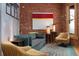 Stylish living room showcasing exposed brick, comfortable seating, and modern decor at 3313 Curtis St, Denver, CO 80205