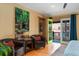 Bright main bedroom features a walkout balcony and spacious sitting area at 3313 Curtis St, Denver, CO 80205