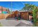 An open shed in the backyard offers space for a workout or storage at 3313 Curtis St, Denver, CO 80205