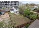 Aerial view of backyard, wooden fence, lawn and back of house at 13438 E 13Th Pl, Aurora, CO 80011