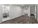 Finished basement featuring wood flooring with a bathroom and closet view at 13438 E 13Th Pl, Aurora, CO 80011