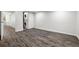 Open basement area with wood flooring and laundry appliances at 13438 E 13Th Pl, Aurora, CO 80011