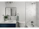 Stylish bathroom featuring marble tile shower and sleek vanity with modern fixtures at 13438 E 13Th Pl, Aurora, CO 80011