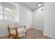 Bright entryway featuring a comfortable chair, wood floors, and plenty of natural light from a window at 13438 E 13Th Pl, Aurora, CO 80011
