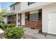 Charming front exterior featuring brick accents and low maintenance landscaping plus an attached garage at 13438 E 13Th Pl, Aurora, CO 80011