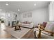 Bright and modern living room with recessed lighting, neutral tones, and wood-look flooring at 13438 E 13Th Pl, Aurora, CO 80011