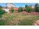 Expansive back yard with terraced landscaping and a shed, perfect for outdoor activities at 3575 W Hamilton Pl, Denver, CO 80236