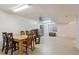 Spacious basement with neutral floors, open layout, table with chairs, and a window at 3575 W Hamilton Pl, Denver, CO 80236
