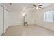 Unfinished basement area with neutral floors, closet, and a window, presenting potential for customization at 3575 W Hamilton Pl, Denver, CO 80236