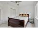 Bedroom with comfortable bed, neutral carpet, ceiling fan, and a large closet, perfect for relaxation and organization at 3575 W Hamilton Pl, Denver, CO 80236
