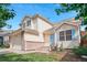 Beautiful two-story home with charming curb appeal, landscaped front yard, and unique architectural details at 3575 W Hamilton Pl, Denver, CO 80236