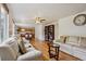 Open living room with hardwood floors that flows into a kitchen area at 3575 W Hamilton Pl, Denver, CO 80236