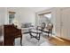 Bright living space with hardwood floors, comfortable seating, and natural lighting from large windows at 3575 W Hamilton Pl, Denver, CO 80236