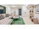 Stylish basement living room with modern decor, including a green rug and decorative ladder at 4131 Quivas St, Denver, CO 80211