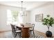 Bright dining room with a large table, contemporary lighting and decor at 4131 Quivas St, Denver, CO 80211