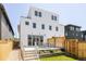 The rear of a modern, multi-story home with a patio and balcony, perfect for outdoor living and entertaining at 4131 Quivas St, Denver, CO 80211