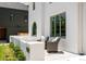 A charming front porch with comfortable seating, framed by well-maintained landscaping, offers a welcoming entrance at 4131 Quivas St, Denver, CO 80211