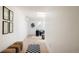Bright hallway with modern decor, skylight, light hardwood floors, and a glimpse of the living room at 4131 Quivas St, Denver, CO 80211