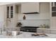 Modern kitchen featuring a stainless steel range hood and high-end appliances at 4131 Quivas St, Denver, CO 80211