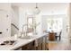 Stylish kitchen with a large island, modern fixtures, and an adjacent dining area at 4131 Quivas St, Denver, CO 80211