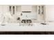 Contemporary kitchen featuring quartz countertops, stainless steel appliances, and sleek cabinetry at 4131 Quivas St, Denver, CO 80211