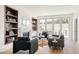 Cozy living room with fireplace, built-in bookshelves, and comfortable seating, creating a relaxing atmosphere at 4131 Quivas St, Denver, CO 80211