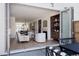 Open-concept floor plan showcases a bright living room with a fireplace and sliding doors for indoor-outdoor living at 4131 Quivas St, Denver, CO 80211