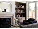 Cozy living room with fireplace, built-in bookshelves, and comfortable seating, creating a relaxing atmosphere at 4131 Quivas St, Denver, CO 80211