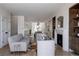 Open-concept living room showcasing a fireplace, modern furniture, and abundant natural light at 4131 Quivas St, Denver, CO 80211