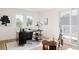 Office with an ample desk, windows offering outside views, and a door to a balcony at 4131 Quivas St, Denver, CO 80211