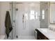 Modern shower with gray subway tile, glass enclosure, and updated fixtures at 4131 Quivas St, Denver, CO 80211