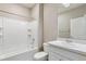 Clean, well-lit bathroom with a white tiled shower and modern fixtures at 18399 Field Mint Pt, Parker, CO 80134