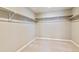 Spacious walk-in closet with ample shelving for organized storage solutions at 18399 Field Mint Pt, Parker, CO 80134