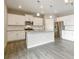 Contemporary kitchen featuring a spacious island, stainless steel appliances, and ample cabinet space at 18399 Field Mint Pt, Parker, CO 80134