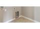 Laundry hook-ups in a room with tile floor and light-colored walls at 18399 Field Mint Pt, Parker, CO 80134