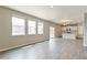 Open concept living space with large windows and sliding glass door, creating a light and airy atmosphere at 18399 Field Mint Pt, Parker, CO 80134