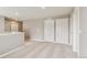 Upper-level loft area with neutral carpet and multiple doors at 18399 Field Mint Pt, Parker, CO 80134