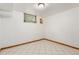 Empty basement space with window and tile flooring at 1591 S Zuni St, Denver, CO 80223