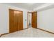 Basement bedroom features a closet and doorway leading to storage at 1591 S Zuni St, Denver, CO 80223
