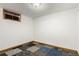 Unfurnished basement with mix-match carpet tiles at 1591 S Zuni St, Denver, CO 80223