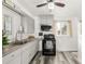 Updated kitchen with gray cabinets, modern appliances, and stylish countertops, perfect for cooking and entertaining at 1591 S Zuni St, Denver, CO 80223