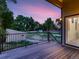 Scenic backyard view from the deck, showcasing lush greenery, a shed, and the tranquil surroundings at 10197 E Mississippi Ave, Aurora, CO 80247