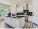 Modern kitchen with stainless steel appliances, a black countertop island, and pendant lighting at 10197 E Mississippi Ave, Aurora, CO 80247