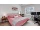 Cozy bedroom with a comfortable bed, natural light, desk and stylish decor at 8500 E Jefferson Ave # 3H, Denver, CO 80237