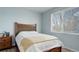 Comfortable bedroom with a view from the bright window and neutral decor at 8500 E Jefferson Ave # 3H, Denver, CO 80237