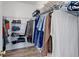 Walk-in closet featuring ample shelving and organized storage for clothing and accessories at 8500 E Jefferson Ave # 3H, Denver, CO 80237