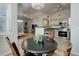 Open-concept dining area flowing into the living room and kitchen, ideal for entertaining and gatherings at 8500 E Jefferson Ave # 3H, Denver, CO 80237