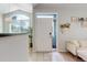 Welcoming entryway with tiled floor, complementing neutral tones and stylish decor at 8500 E Jefferson Ave # 3H, Denver, CO 80237